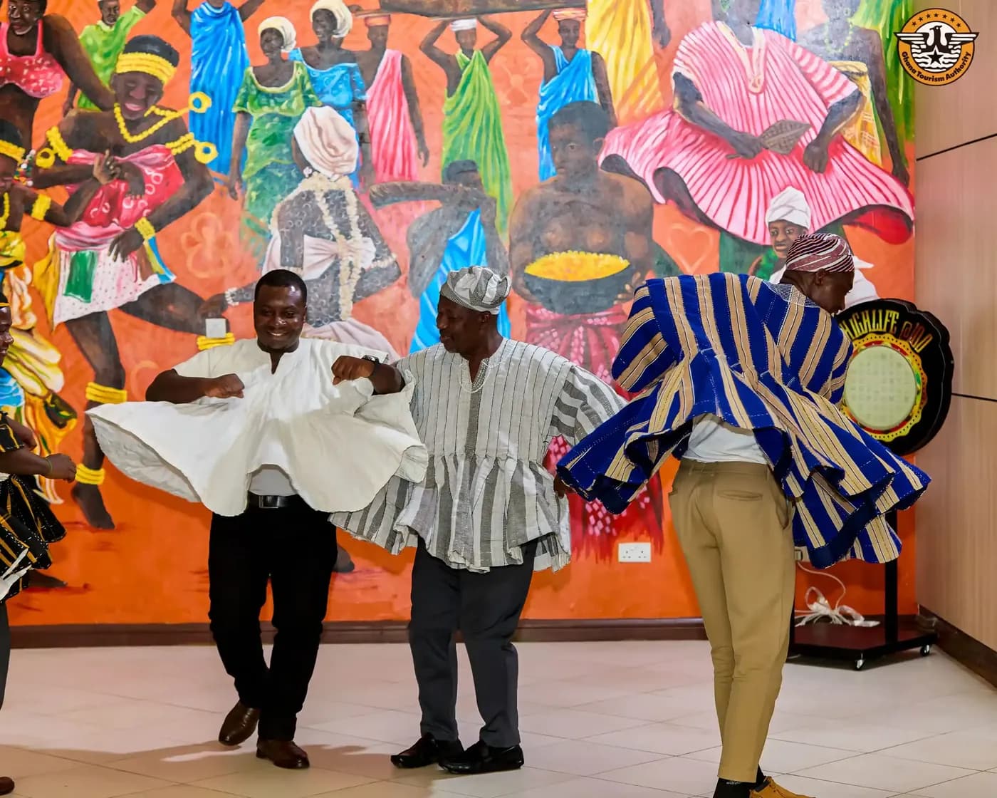 Dancers in kente and fugu